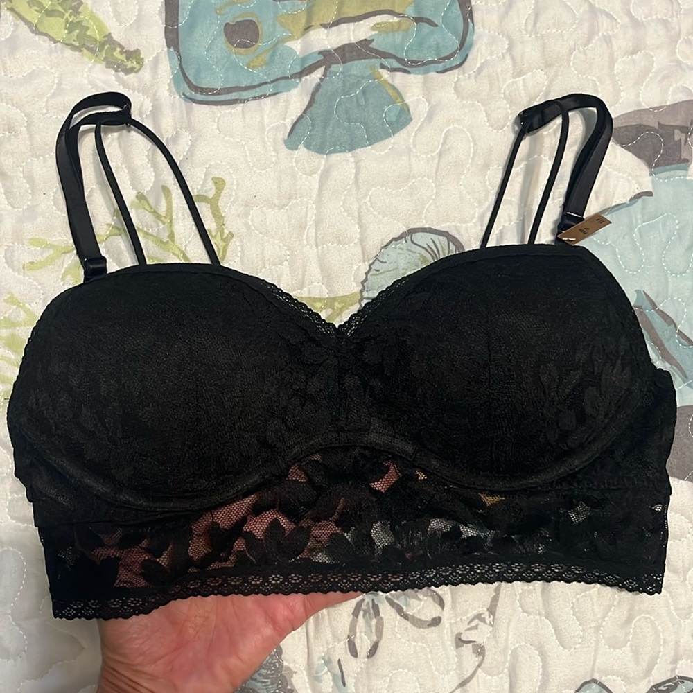 Black lace molded cup sports bra with underwire and stretchy lace around bottom